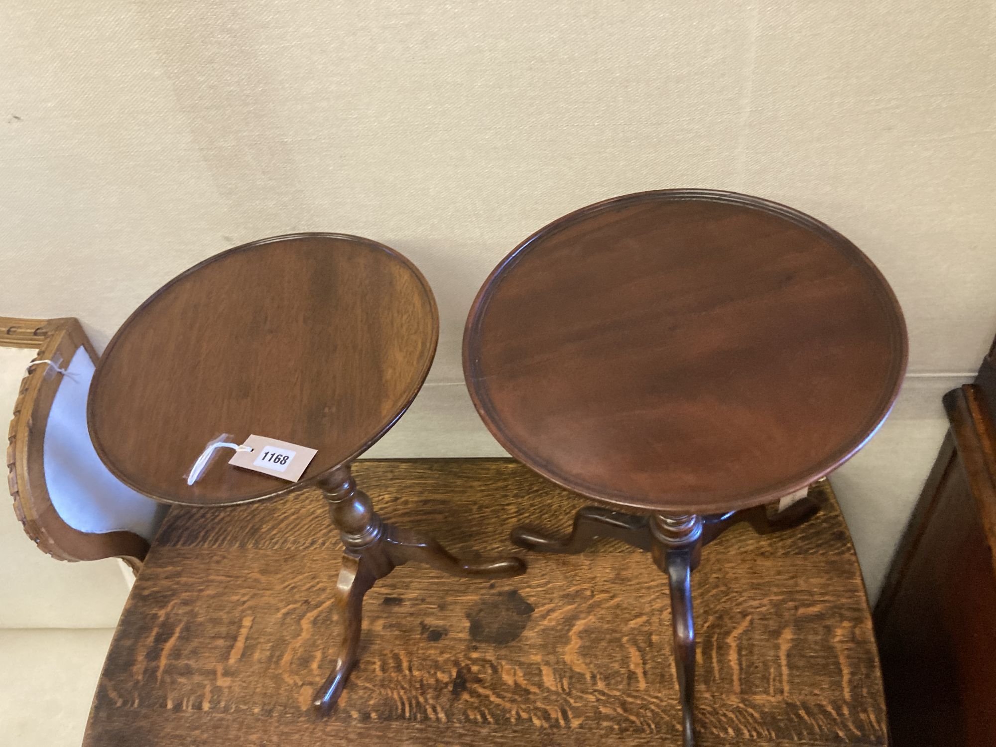 Two reproduction mahogany tripod wine tables, larger 38cm diameter, height 54cm